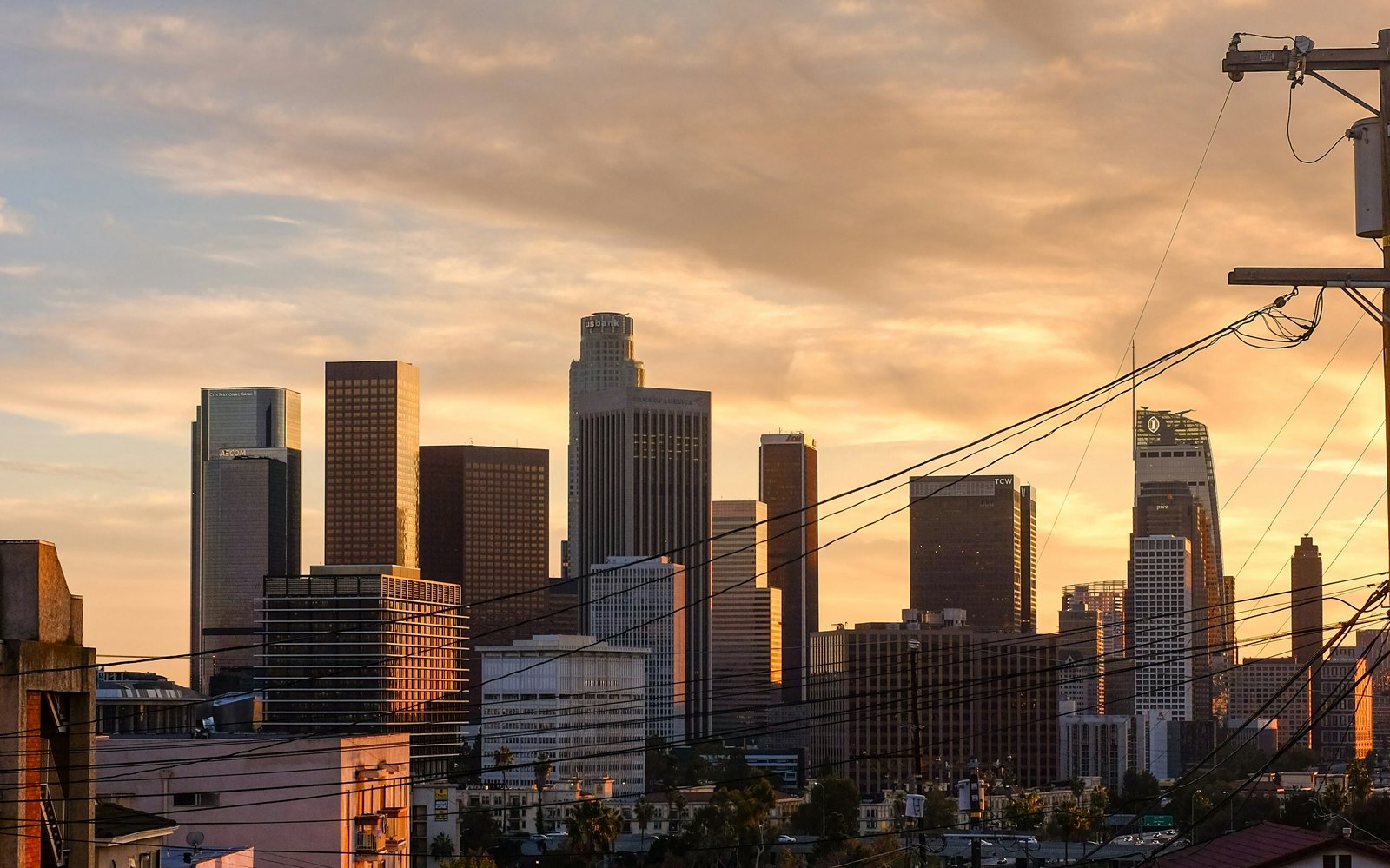 The Downtown skyline at sunset from a hillside street