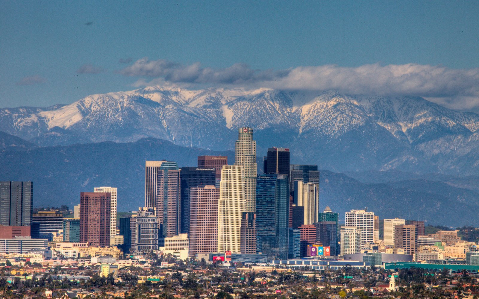 The Downtown Los Angeles skyline with the San Gabriel Mountains behind it