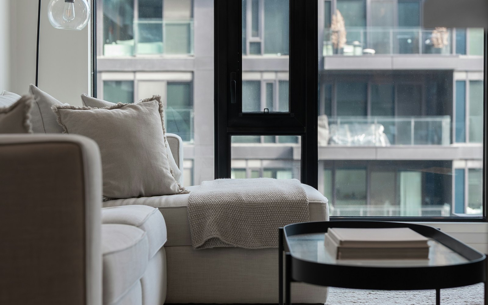 A condo living room looking across to the next tower